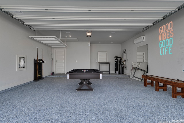 garage featuring a garage door opener, recessed lighting, and a wall unit AC