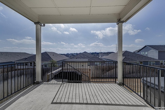 view of patio / terrace featuring a balcony and a residential view