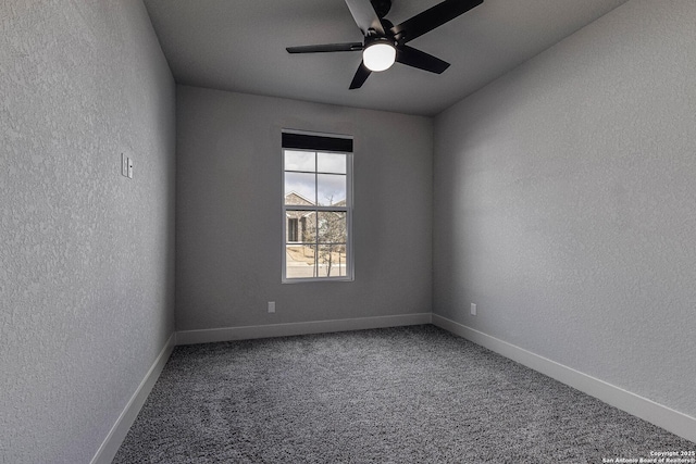 empty room featuring ceiling fan, baseboards, carpet flooring, and a textured wall