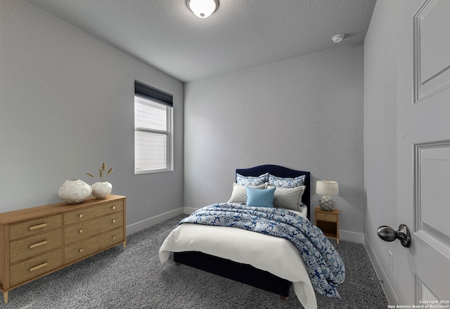 carpeted bedroom with a textured wall, a textured ceiling, and baseboards