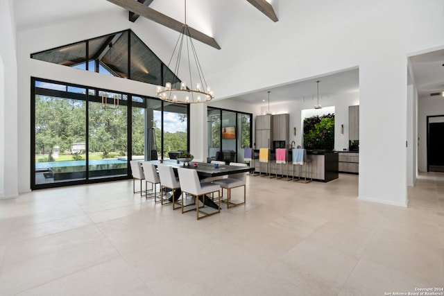 dining area with beamed ceiling, high vaulted ceiling, and a notable chandelier