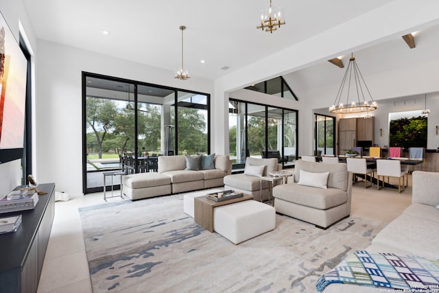 living room featuring a notable chandelier and vaulted ceiling with beams