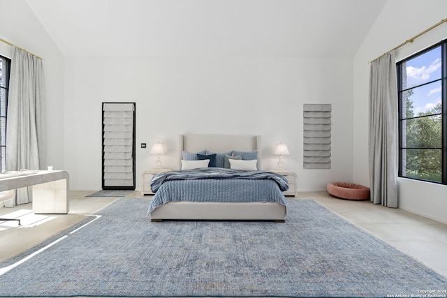 carpeted bedroom with lofted ceiling