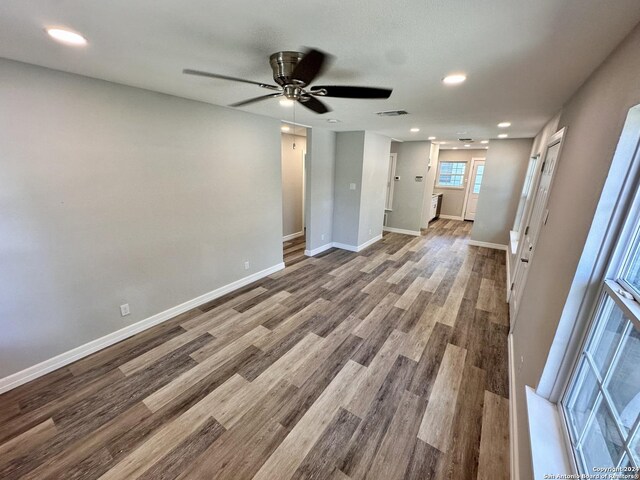 empty room featuring ceiling fan and hardwood / wood-style flooring