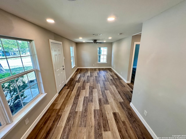 interior space with ceiling fan and hardwood / wood-style flooring