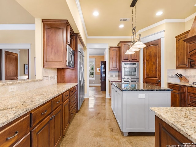 kitchen with light stone countertops, pendant lighting, decorative backsplash, and built in appliances