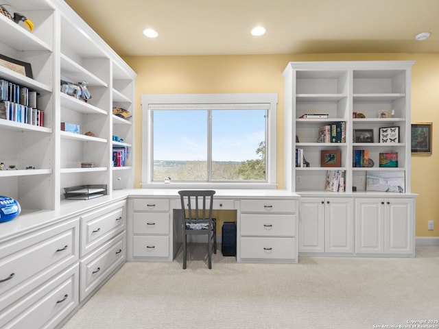 home office with light carpet, built in desk, and recessed lighting