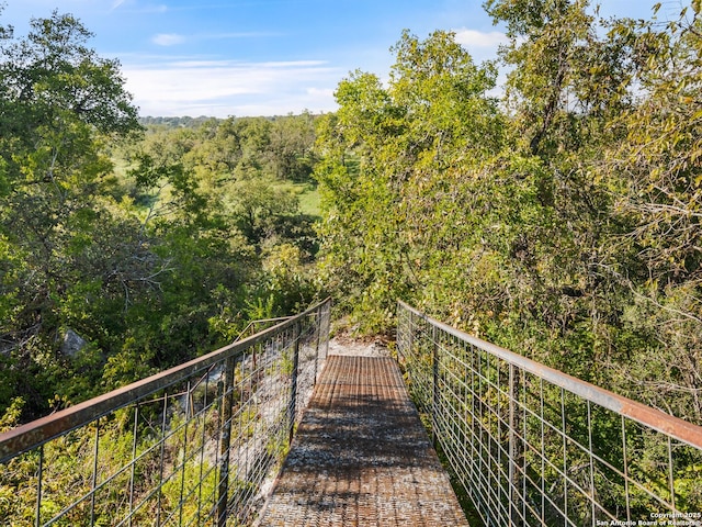 view of community featuring a forest view