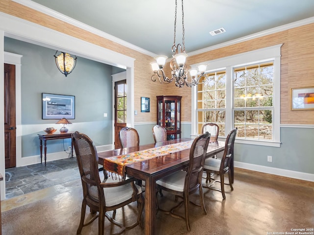 dining area with baseboards, finished concrete floors, visible vents, and ornamental molding