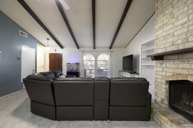 living room featuring vaulted ceiling with beams, a brick fireplace, visible vents, and a textured ceiling