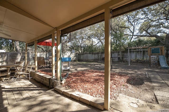 view of patio with outdoor dining area and a fenced backyard