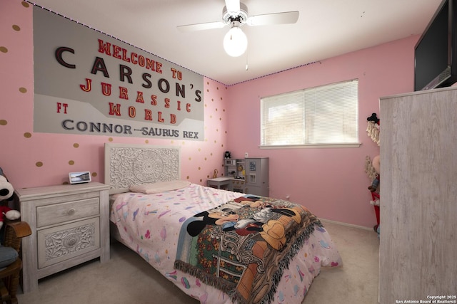 bedroom featuring a ceiling fan and carpet