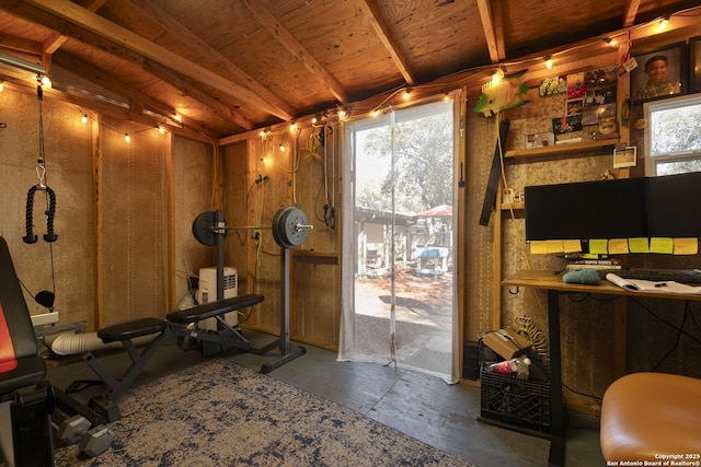 exercise room with vaulted ceiling