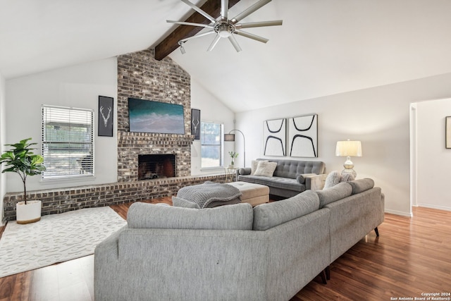 living room featuring a fireplace, vaulted ceiling with beams, ceiling fan, and dark hardwood / wood-style floors