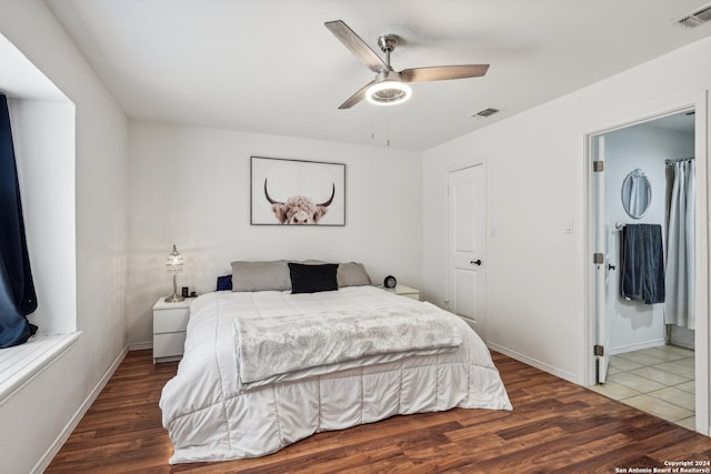 bedroom featuring dark hardwood / wood-style flooring and ceiling fan