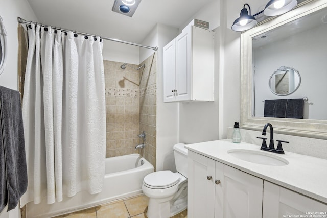 full bathroom featuring tile patterned flooring, vanity, toilet, and shower / bath combo with shower curtain