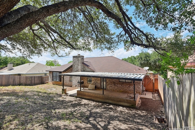 rear view of property with a patio area