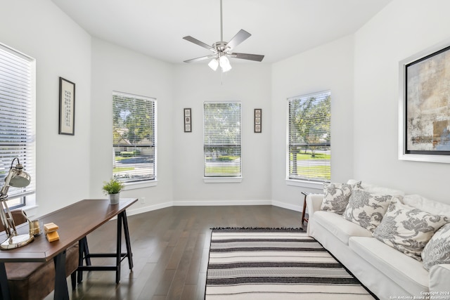 living room featuring dark hardwood / wood-style floors and ceiling fan