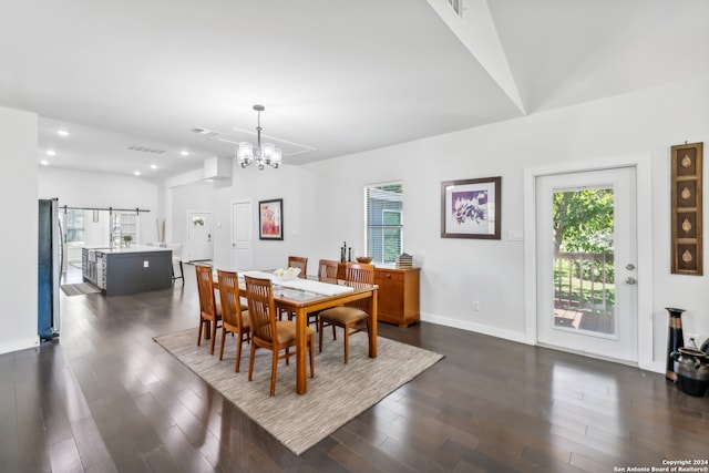 dining room featuring a notable chandelier, dark hardwood / wood-style floors, and a healthy amount of sunlight