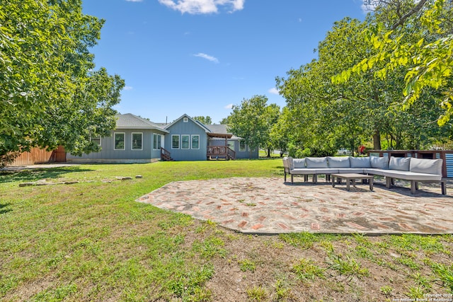 view of yard featuring an outdoor living space and a patio