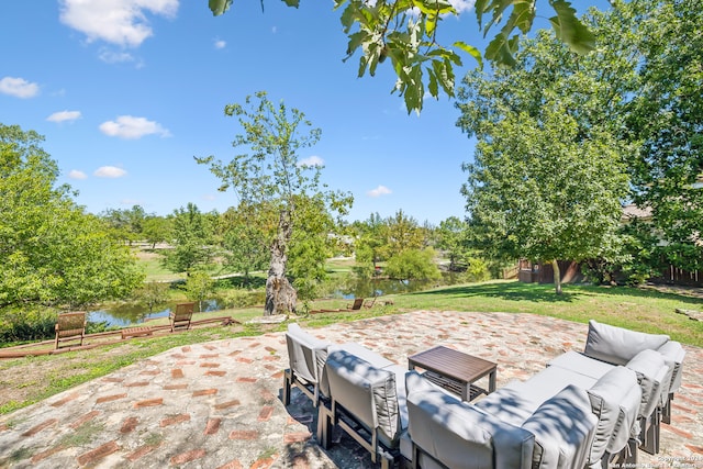 view of patio / terrace with an outdoor hangout area and a water view