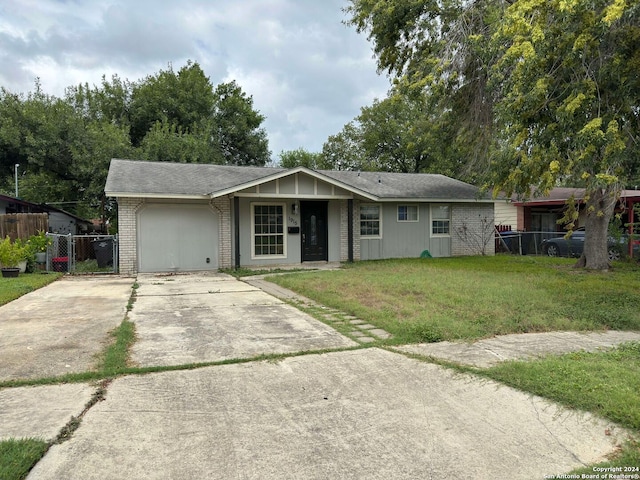 single story home featuring a front yard