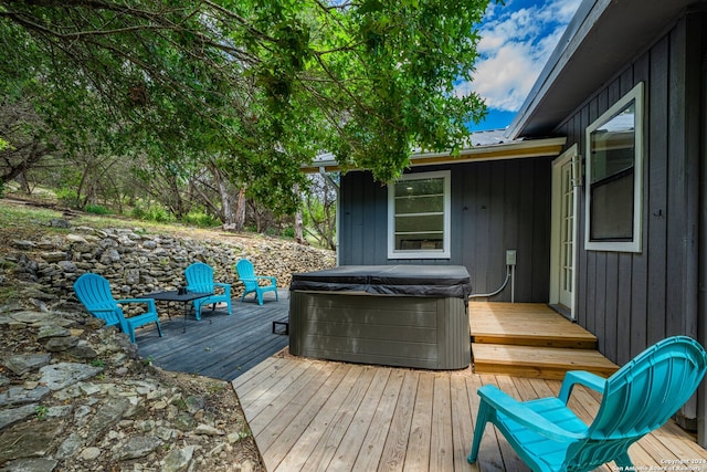 wooden terrace with a hot tub