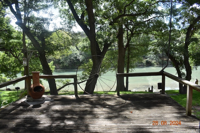 deck featuring a water view