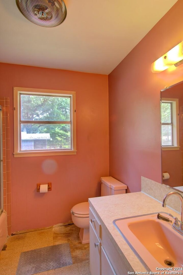 bathroom with visible vents, toilet, and vanity