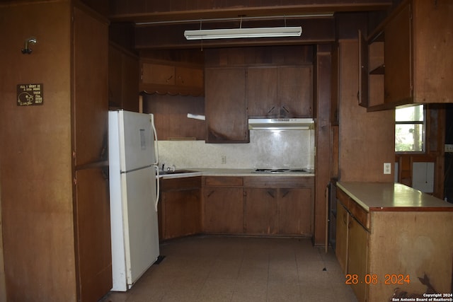 kitchen with white fridge, gas stovetop, and sink