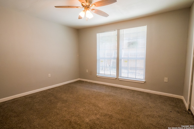 empty room featuring ceiling fan and carpet floors