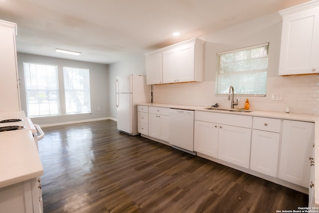 kitchen with dark wood-type flooring, white appliances, white cabinetry, and sink