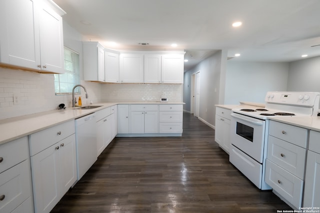 kitchen with dark wood-type flooring, white appliances, and white cabinetry