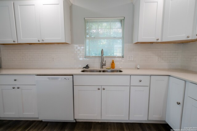 kitchen featuring dishwasher, dark hardwood / wood-style floors, white cabinetry, and sink