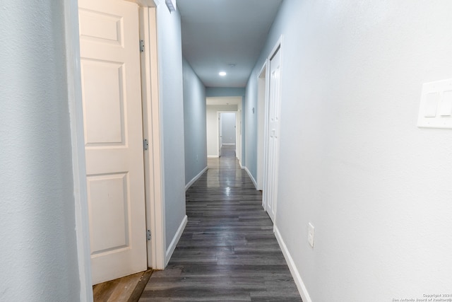 corridor featuring dark wood-type flooring