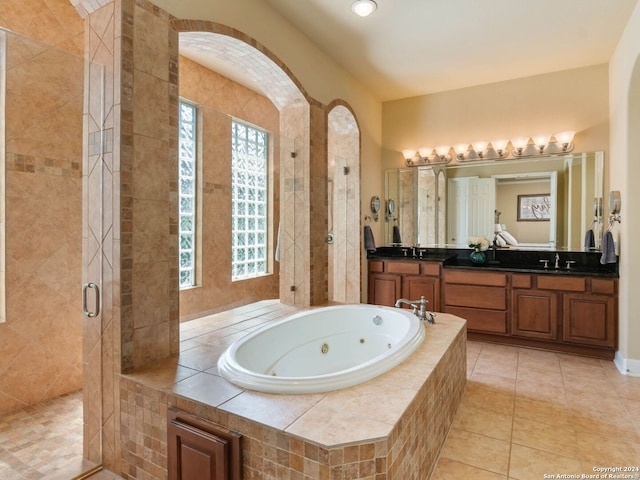 bathroom with vanity, independent shower and bath, and tile patterned floors