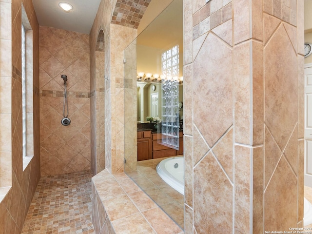 bathroom with independent shower and bath and vanity