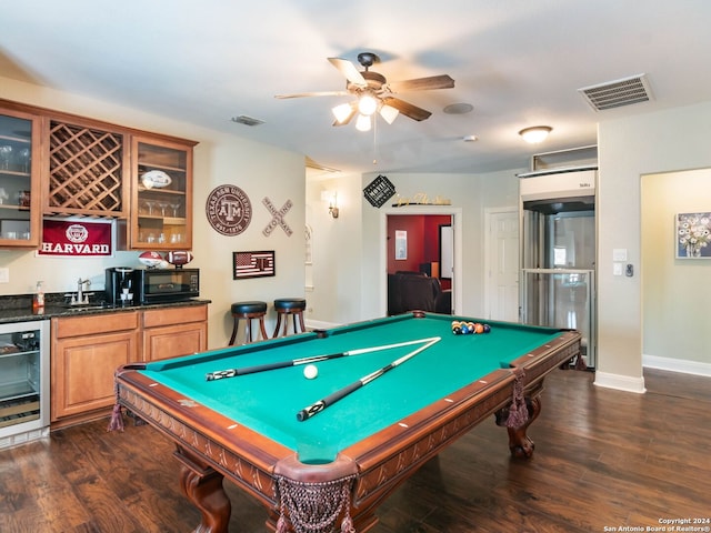 game room featuring billiards, wine cooler, wet bar, ceiling fan, and dark wood-type flooring