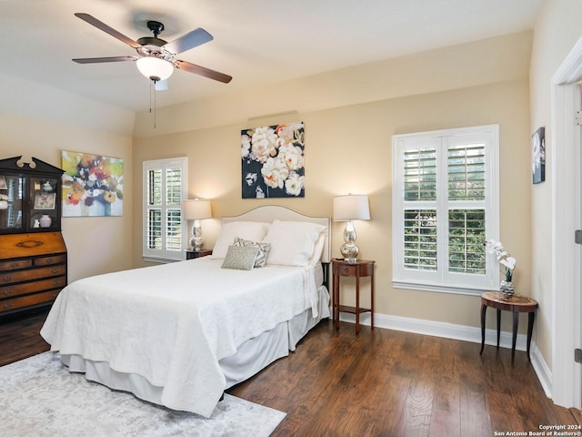 bedroom with ceiling fan and dark hardwood / wood-style floors