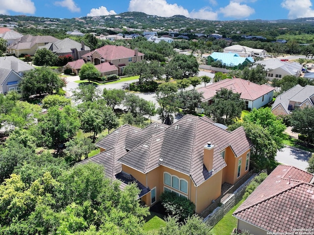 birds eye view of property featuring a mountain view