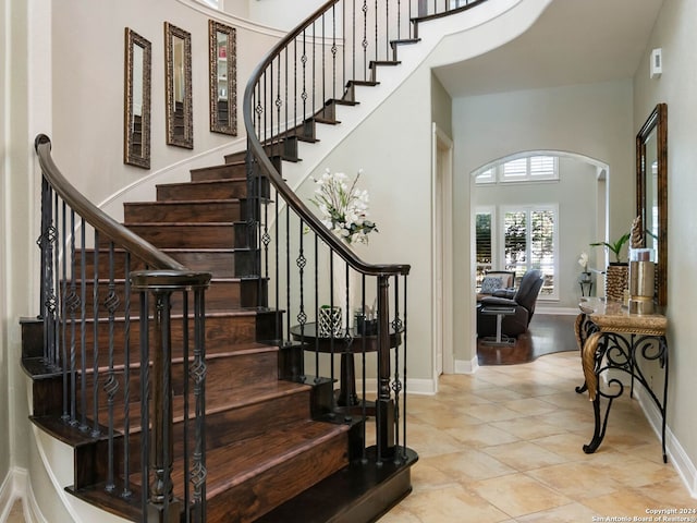 stairs featuring tile patterned flooring