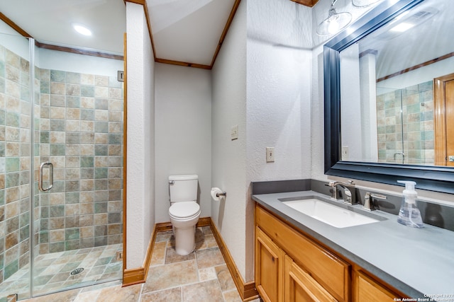 bathroom with a shower with shower door, toilet, and vanity