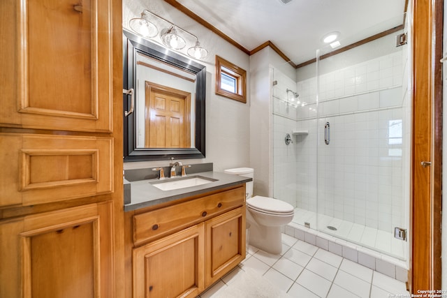 bathroom with a shower with shower door, vanity, toilet, ornamental molding, and tile patterned floors