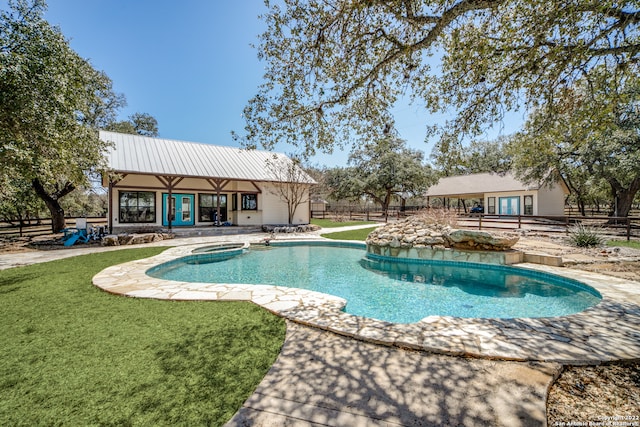 view of swimming pool featuring a yard and a patio