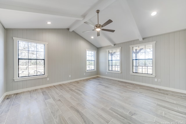 spare room featuring lofted ceiling with beams, ceiling fan, and light hardwood / wood-style floors