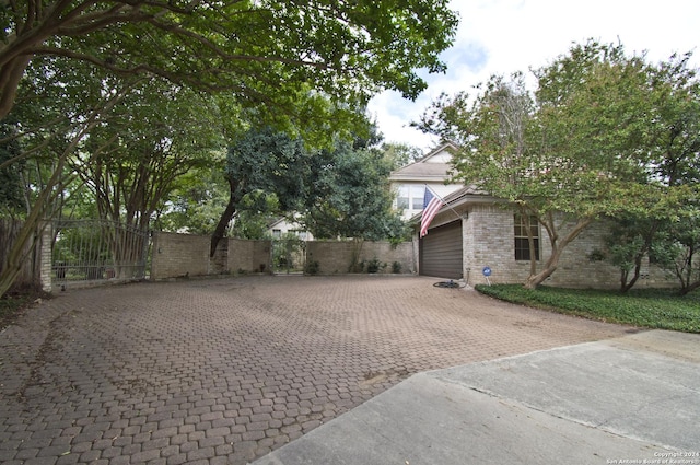 9 Scarborough Sq, San Antonio, TX 78218 - view of patio / terrace featuring decorative driveway, a gate, and fence