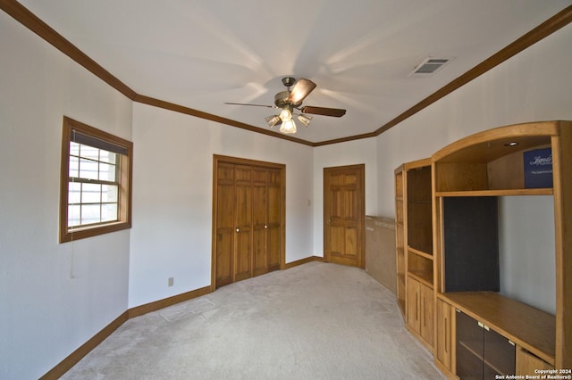 9 Scarborough Sq, San Antonio, TX 78218 - unfurnished bedroom featuring a closet, crown molding, visible vents, baseboards, and light colored carpet