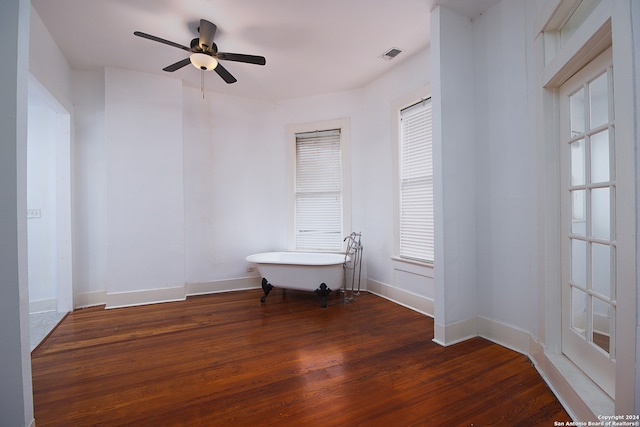 unfurnished room with ceiling fan and dark hardwood / wood-style floors