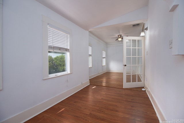 interior space featuring lofted ceiling, ceiling fan, and dark hardwood / wood-style floors