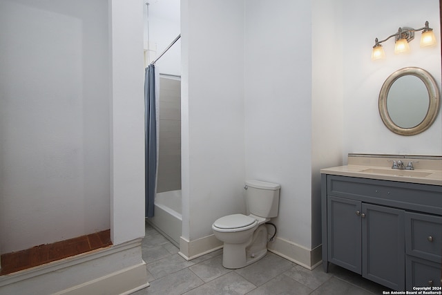 full bathroom featuring tile patterned flooring, toilet, shower / tub combo with curtain, and vanity